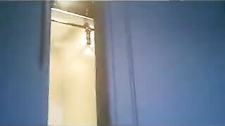 A wife is running around the apartment in a thong while being chased by the troops