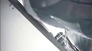 The camera is hidden at the checkout in the shop and it shoots up the skirts of girls