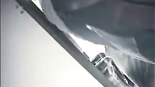 The camera is hidden at the checkout in the shop and it shoots up the skirts of girls