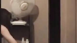 Guy admires his reflection in the mirror completely naked