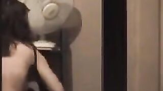 Guy admires his reflection in the mirror completely naked