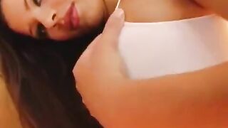 The girl plays with a dildo and showcases her wet vagina in close-up