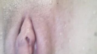 A hot girl has an orgasm under the water and close up