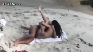 A couple has sex on the beach with a hidden camera capturing it all
