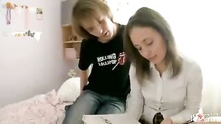 A cute girl has an entertaining time with her classmate at home