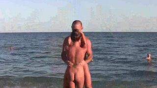 A naked acrobat performs on the beach with amazing agility
