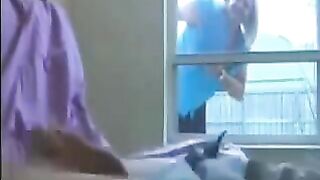 A woman spies on a guy who is jerking off in the ward