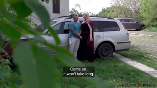 A hot mature blonde is having fun with an unexpected companion in the car