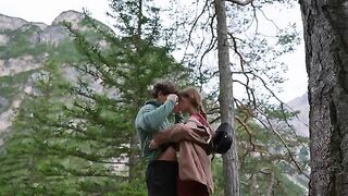 A couple making love outdoors in the forest, with intimate connection