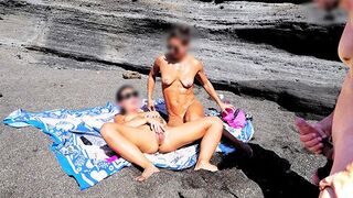 A girl has removed her swimming suit on the beach and masturbated