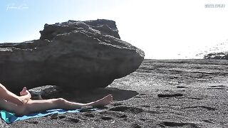 A girl has removed her swimming suit on the beach and masturbated