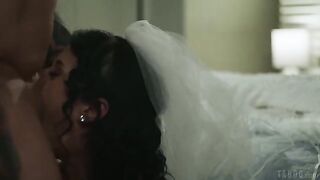 A brunette with a tattoo gets fucked on the bed in doggystyle