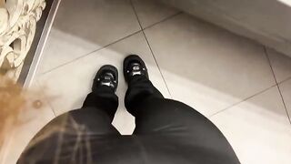 A girl was jerking off in the public toilet, showcasing her green eyes