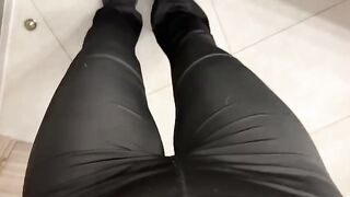 A girl was jerking off in the public toilet, showcasing her green eyes