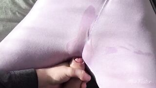 A girl rubs her wet pussy with her thumb and slides it inside