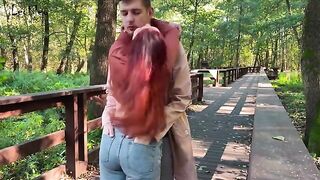 Couple engaged in public anal play with a butt plug